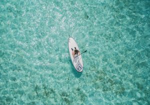 aerial photo of person using paddleboard