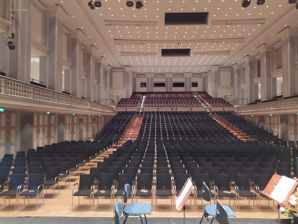 people sitting on chairs inside building